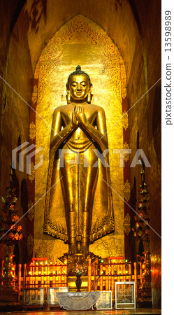 Buddha inside Ananda Temple, Bagan, Myanmar.. 13598989