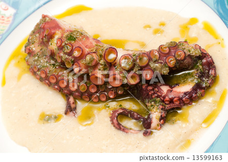 Boiled octopus on potato mousse. 13599163