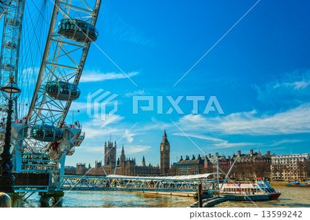 LONDON - MARCH 19 : The London Eye, erected in 1999, is a giant 13599242