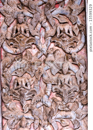 Decorated wooden door in a Buddhist temple in Luang Prabang, Lao 13599329