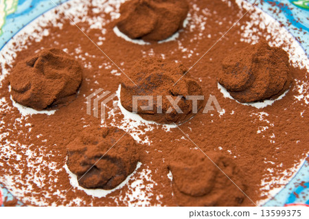 Small Tartufoes chocolate in an elegant dish. 13599375