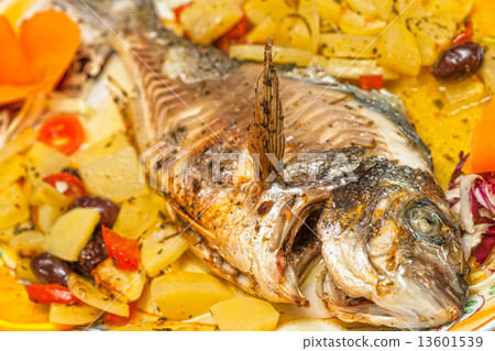 Fresh fish cooked with potatoes and tomatoes. Fresh fish cooked with potatoes and tomatoes. 13601539