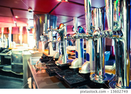 Shiny beer taps in a row 13602749