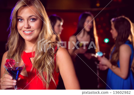 Pretty blonde drinking a cocktail Pretty blonde drinking a cocktail 13602982