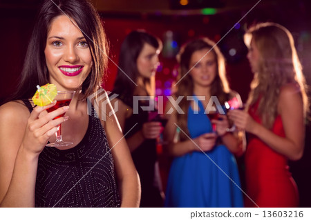 Pretty brunette drinking a cocktail Pretty brunette drinking a cocktail 13603216