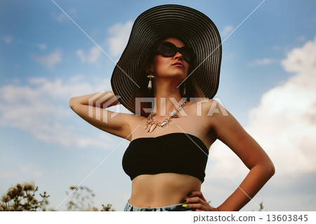 Beautiful girl in hat and sunglasses 13603845