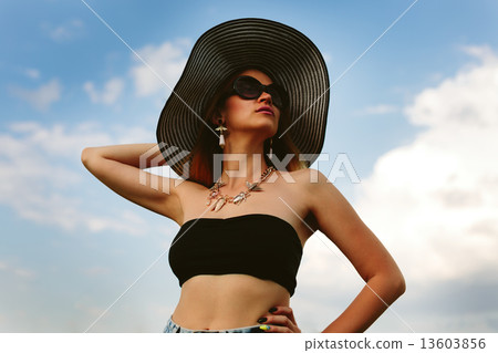 Beautiful girl in hat and sunglasses 13603856