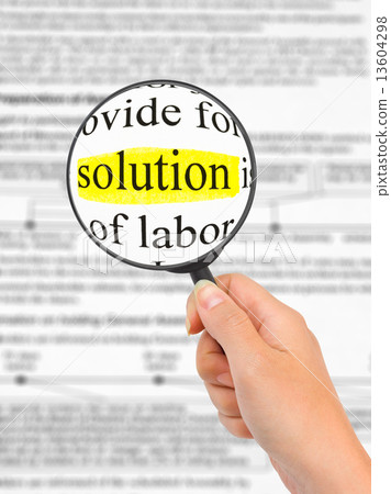 Magnifying glass in hand and word Solution 13604298