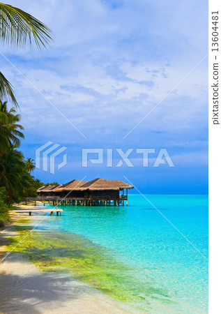 Water bungalows on a tropical island Water bungalows on a tropical island 13604481