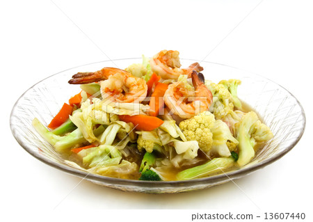 Stir-fried vegetables with shrimp on a plate. 13607440