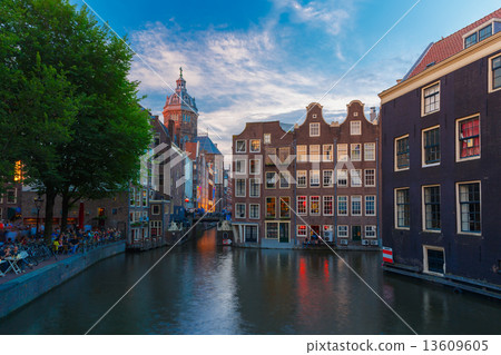 Night city view of Amsterdam canal, church and bridge 13609605