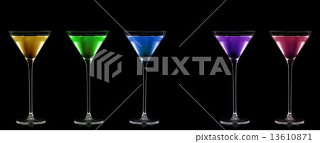 Five Stemmed Cocktail Glasses Full of Colored Liquors. 13610871