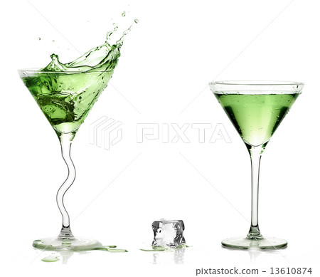 Martini Glasses with Splashing Green Cocktails. Martini Glasses with Splashing Green Cocktails. 13610874
