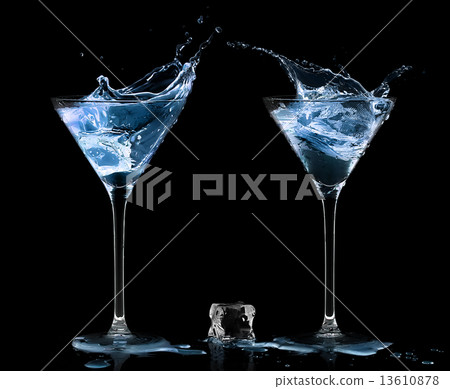 Two Cocktail Glasses with Blue Vodka. 13610878