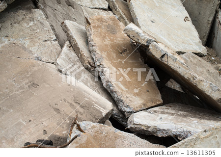 Heap of the damaged concrete blocks 13611305