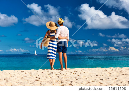 Couple on a beach at Seychelles 13611508