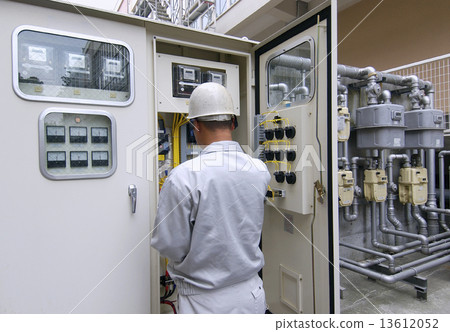 A person who inspects electricity at a substation facility A person who inspects electricity at a substation facility 13612052