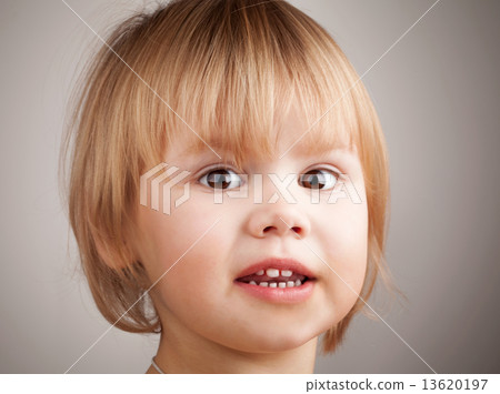 Close-up portrait of cute blond Caucasian baby girl 13620197