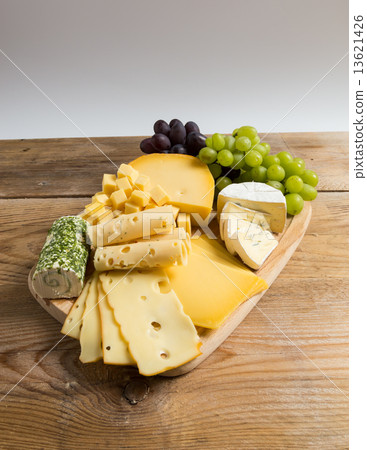 Cheese plate variation on a wooden table Cheese plate variation on a wooden table 13621426