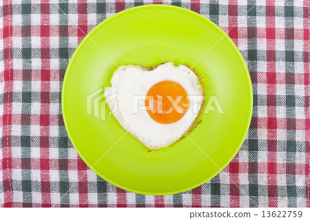 Scrambled in a heart shape on a plate. Scrambled in a heart shape on a plate. 13622759