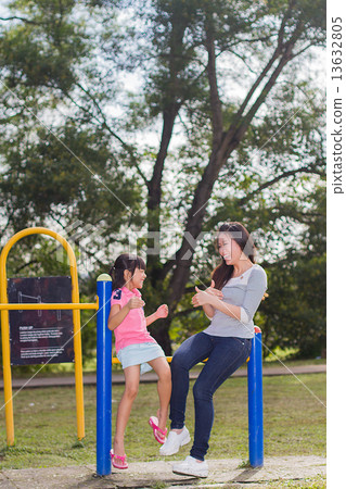 Asian Mother and Daughter in the Park Asian Mother and Daughter in the Park 13632805