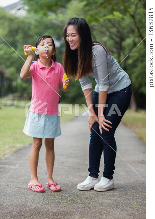 Asian Mother and Daughter in the Park Asian Mother and Daughter in the Park 13632815