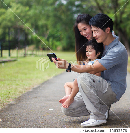 Asian Family in the Park 13633778