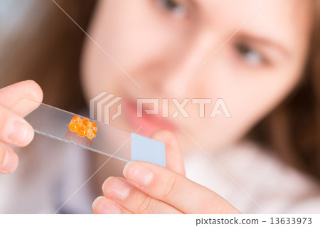 girl in the laboratory of food quality tests caviar girl in the laboratory of food quality tests caviar 13633973
