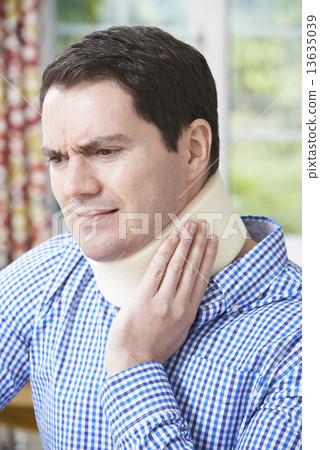 Man Wearing Surgical Collar In Pain 13635039