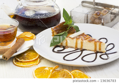 piece of cheese cake on a table in a restaurant piece of cheese cake on a table in a restaurant 13636783