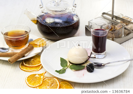 creamy dessert is decorated with blackberries on a white background creamy dessert is decorated with blackberries on a white background 13636784