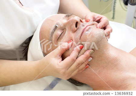 man in a beauty salon facial and massage 13636932