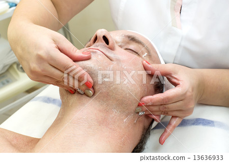 man in a beauty salon facial and massage man in a beauty salon facial and massage 13636933