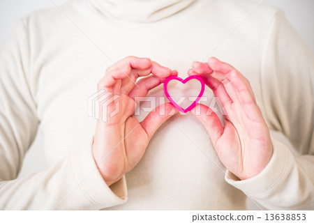 A woman with a pink heart A woman with a pink heart 13638853
