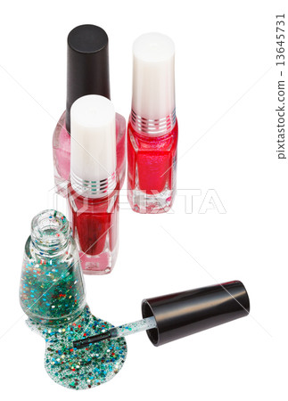nail polish bottles and spilled green lacquer 13645731