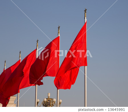 Red flags on the Tiananmen Square -- is a large city square in the center of Beijing, China Red flags on the Tiananmen Square -- is a large city square in the center of Beijing, China 13645991