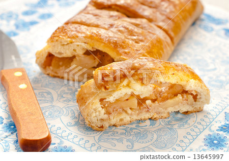 slice of an apple strudel on the table slice of an apple strudel on the table 13645997