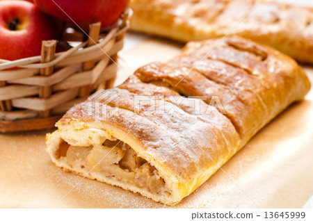 slice of an apple strudel on the table slice of an apple strudel on the table 13645999