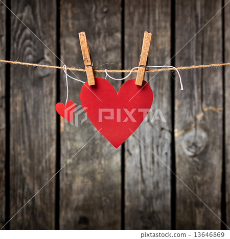 Two Paper Hearts Hang on Clothesline 13646869