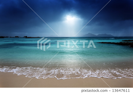 dark sky on the beach of la Digue island, Seychelles 13647611