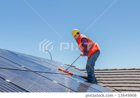 worker and solar panels 13649906