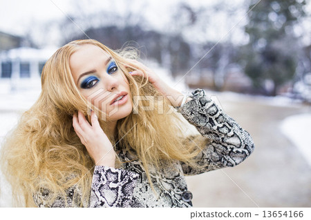 Golden haired woman posing outside Golden haired woman posing outside 13654166