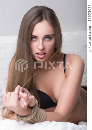 model tied up with fetish restraint rope. 13655083