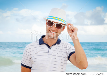 Outdoor portrait of young smiling Caucasian man 13655296
