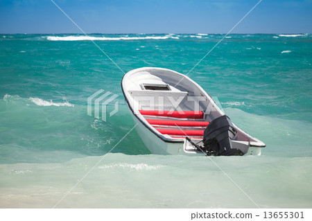 White pleasure boat floats on stormy water 13655301