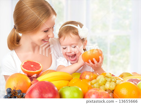 happy family mother and daughter little girl, eat healthy vegetarian food, fruit happy family mother and daughter little girl, eat healthy vegetarian food, fruit 13655666