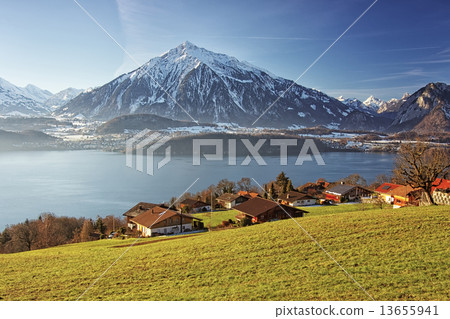 Panoramic lakeview in Swiss mountains near the Thun lake in wint Panoramic lakeview in Swiss mountains near the Thun lake in wint 13655941