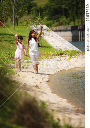 Family, Three, happy, pretty, handsome, kid, embrace, park, couple, outdoor activity, picnic, enjoys 13657689