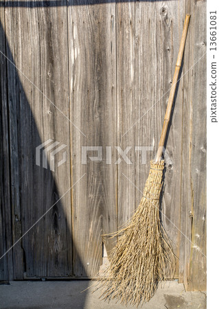 Bamboo skirt before wooden building Bamboo skirt before wooden building 13661081