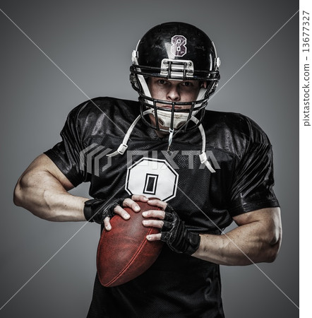 American football player with ball 13677327